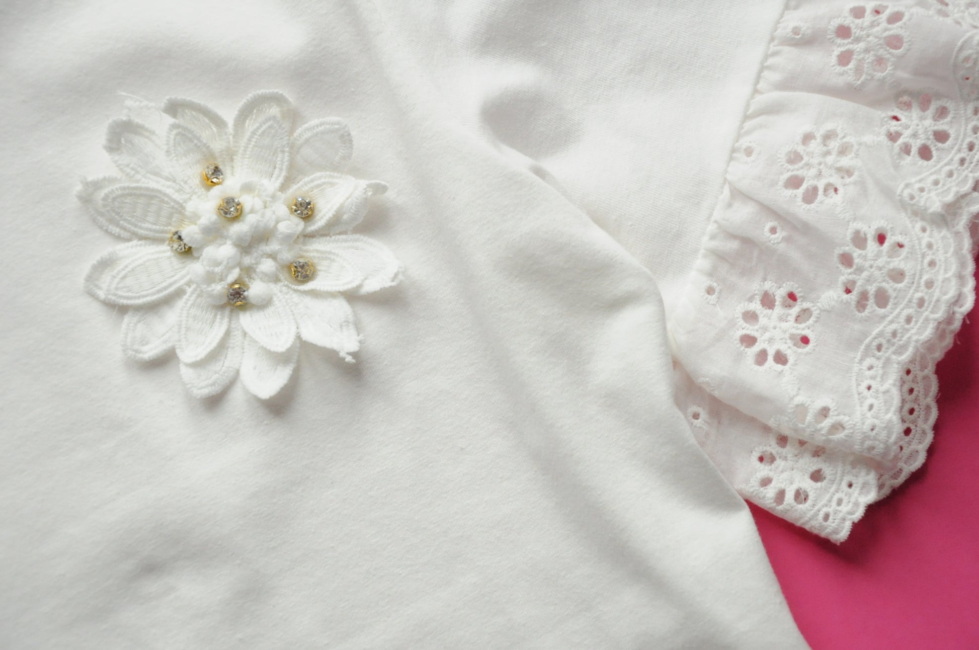 Off white broderie anglaise frilled peplum tee with 3D gem flower detail