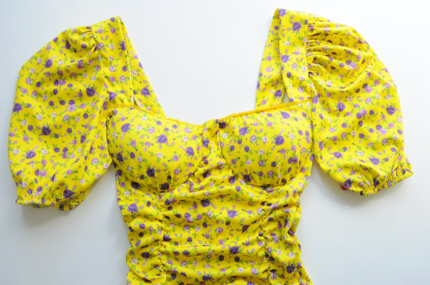 Floral drapped mini dress in yellow