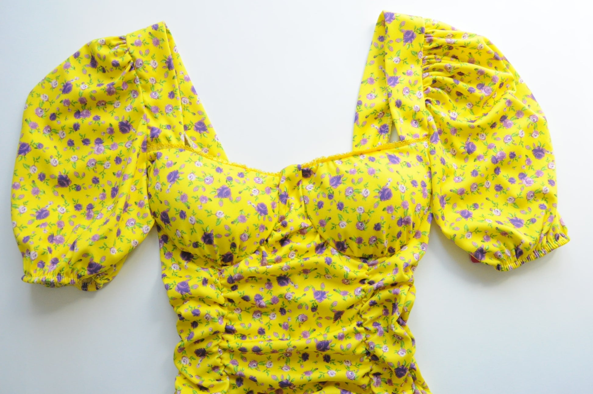 Floral drapped mini dress in yellow